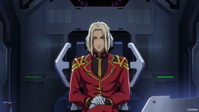 Homem de uniforme vermelho sentado numa cadeira de comando